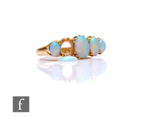 An 18ct hallmarked graduated five stone opal ring, claw set stones to plain shoulders, one stone loose, weight 4.8g, ring siz