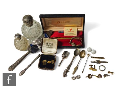 A collection of silver and gold items, to include a pair of 9ct gold cufflinks, a Giorgio Armani silver ring, a pair of Chris