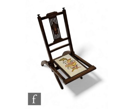 An Edwardian inlaid mahogany steamer type folding chair, the pierced splat decorated with urn and floral border, tapestry wor