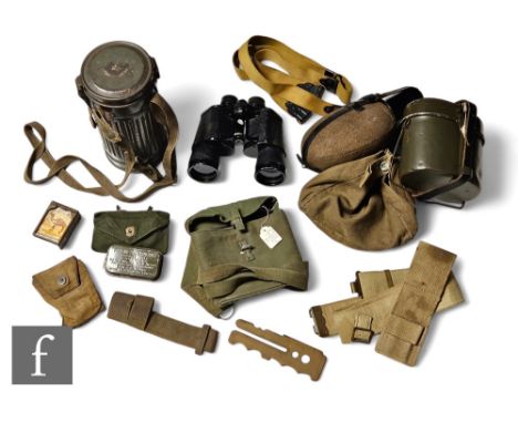 A gas mask in field green cannister, a mess tin, a water bottle, a US first aid tin, accessories and a pair of Zenith binocul