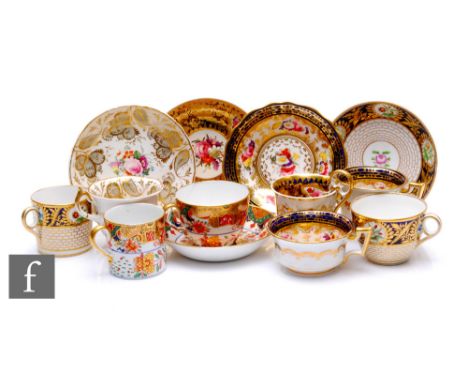 A collection of 19th Century tea wares, including a Sevres style trio decorated with a band of floral cartouche over blue gro