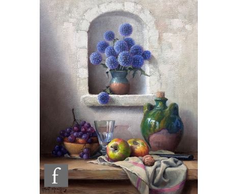 ROBERT CHAILLOUX (FRENCH, 1913-2006) - A still life with blue globe thistles, apples, grapes and pottery jars on a table top,