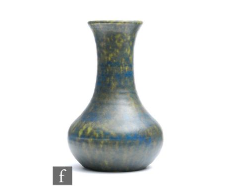 A Ruskin Pottery vase of globe and shaft form decorated in a mottled blue and dark green crystalline glaze, unmarked, height 