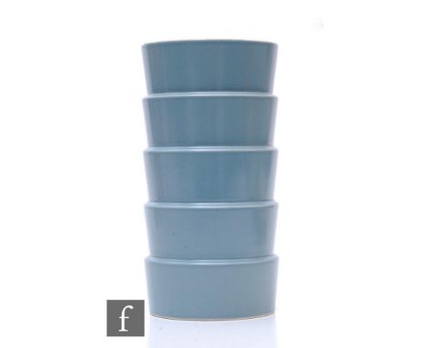 A 1930s Wedgwood Art Deco table lamp designed by Keith Murray, of stepped cylindrical section, decorated in a grey glazed fin