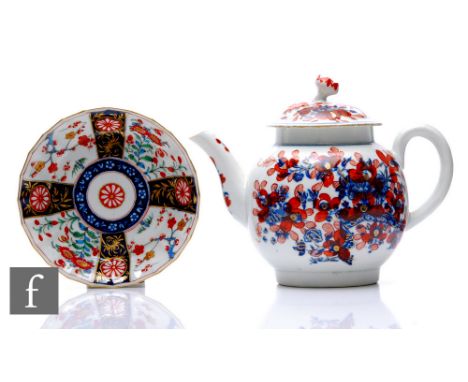 An 18th Century Worcester clobbered blue and white teapot, circa 1775, of globular form, transfer printed in the Three Flower