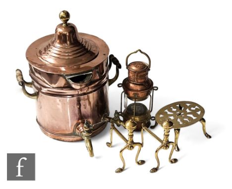 A large copper twin handled samovar and cover with twin brass spouts, height 51cm, a small copper and brass lamp, a trivet an