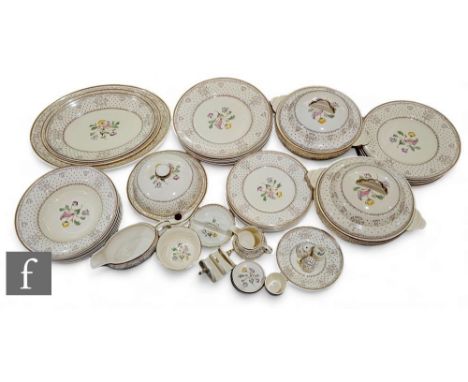 A large and comprehensive Clarice Cliff dinner service to include graduated plates, tureens, toast rack, preserve dish, bulle