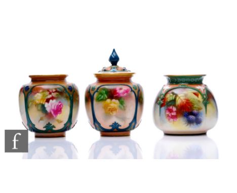 A Hadley's Worcester pot pourri vase and cover of ovoid form, the reticulated lid with moulded flowers within teal enamelled 