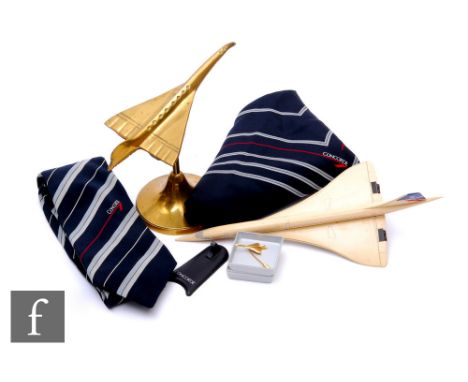 A brass desk model of Concorde, another plastic model, damaged stand, a tie pin, a lady's scarf and a gentleman's tie. (5)  P