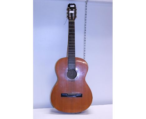A vintage acoustic guitar. Postage unavailable 