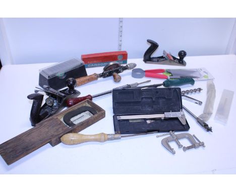 A box of assorted vintage woodworking tools 