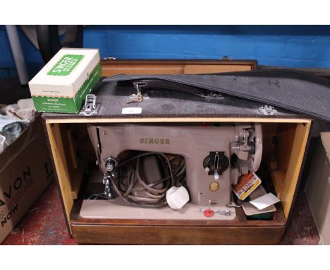A vintage Singer electric sewing machine.  Postage unavailable 