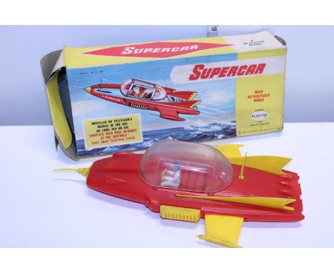 A vintage boxed Plaston Super Car model 
