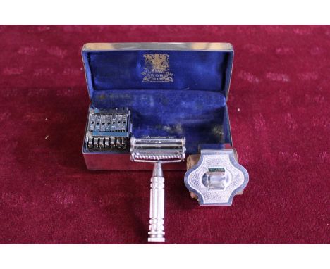 A boxed vintage Wilkinson Sword travel razor set complete with strope for sharpening the blades 