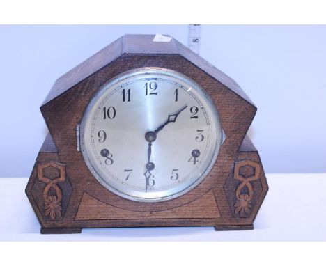 A vintage wooden cased mantle clock. Postage unavailable 