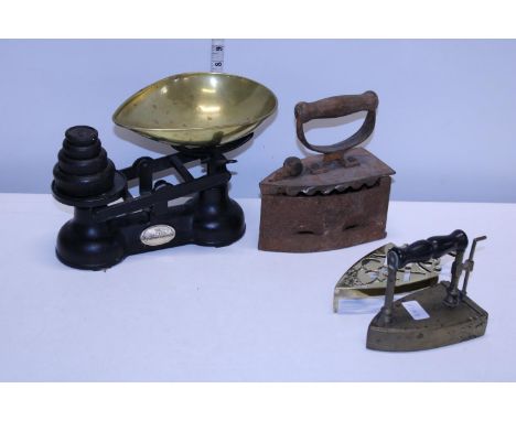 A vintage set of scales &amp; weights and two vintage irons. postage unavailable 
