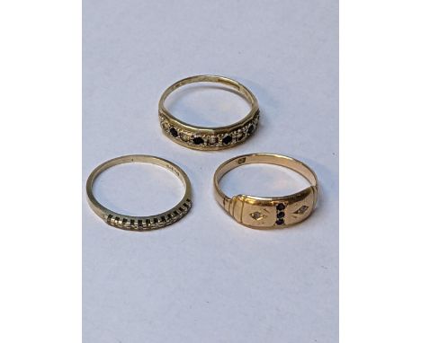 A 9ct diamond ring, another 9ct gold ring with diamonds and blue stones, and a 9ct gold gypsy ring, total 5gLocation: 