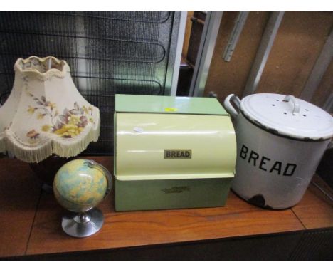 A mixed lot to include an art deco glass lamp base with shade, two enamel bread bins, and a small Fucashun toy globe Location