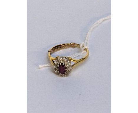 An 18ct gold ring with a ruby and illusion set diamonds, 3.2gLocation: 