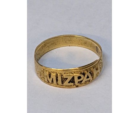 A yellow metal ring reading 'Mizpah', 2.7g Location: 