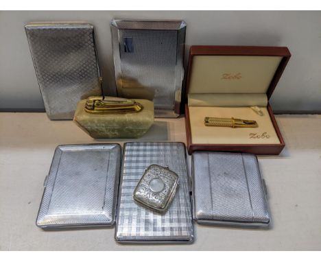 Smoking related to include a silver vesta case Chester 1902, by William Neale, five silver plated cigarette cases, a lighter 