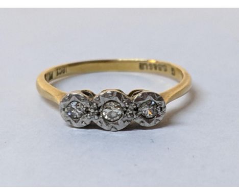 An 18ct gold and platinum diamond three stone ring, 2.1gLocation: 