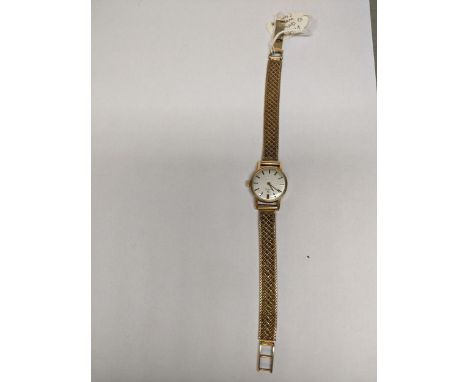 An Omega 9ct gold ladies manual wind watch on a 9ct gold bracelet, 20.5g Location: 