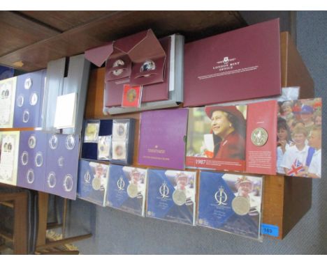 A collection of Royal and London Mint commemorative £5 and other coins, in original packaging, some with enamel decoration, a