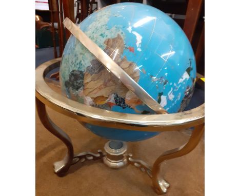 A mineral terrestrial globe with inset mother of pearl and abalone in a brass coloured stand with compass uniting 3 lower str