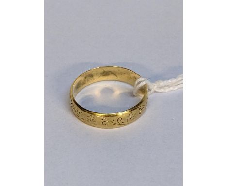 A 18ct gold wedding ring with engraved ornaments, 3.8gLocation: 