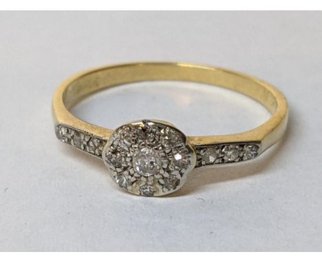 A yellow metal diamond set ring with diamond shoulders, 2.5gLocation: 
