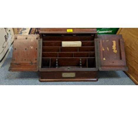 An Edwardian oak stationery box with plaque inscribed 'Presented to R E Mess Gibraltar By Colonel C Wilkinson RE April 1906' 