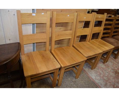 Set of four modern light oak hard seated dining chairs