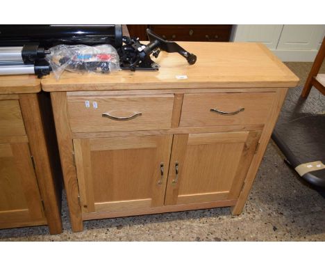 A modern light oak two door two drawer sideboard, 90cm wide