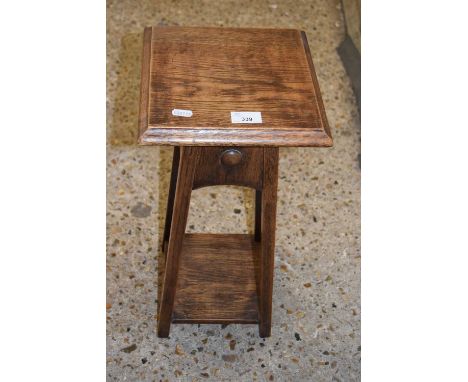 A small light oak plant stand