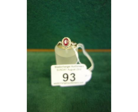 Ladies 9ct gold Ruby and Diamond ring size J a ruby to the top surrounded by diamond chips on the surround and shoulders, 