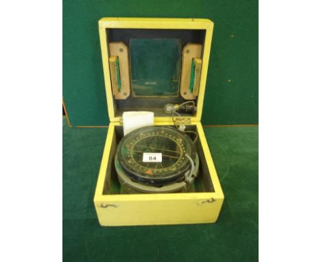 Pine box containing a ships Compass