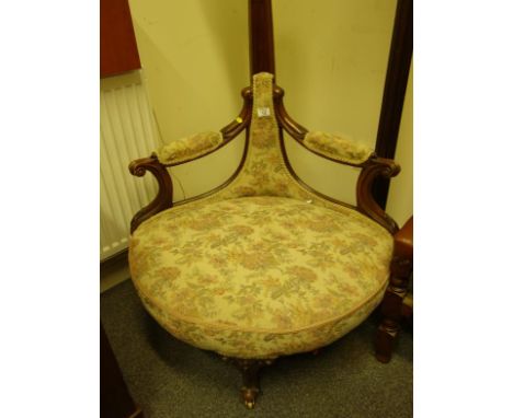 Delicate 19c corner seat with twin arms and Tapestry upholstery on small supports with brass castors, 