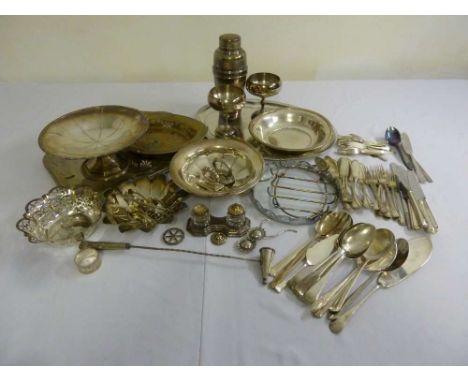 A quantity of silver plate to include a cocktail shaker, condiment set, cake stands and flatware