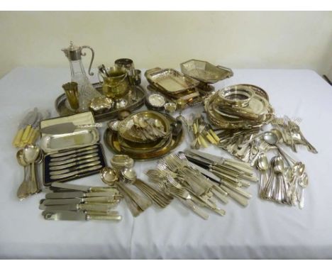 A quantity of silver plate to include a claret jug, cake dishes and flatware