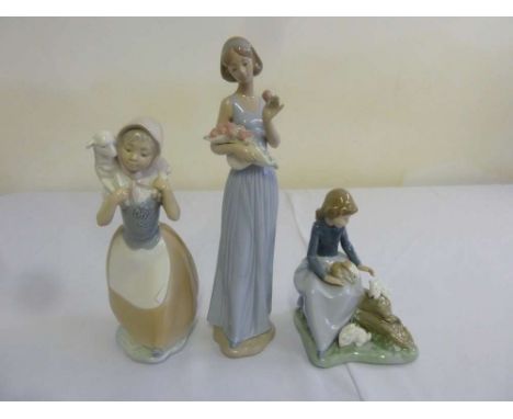 Three Nao figurines of girls