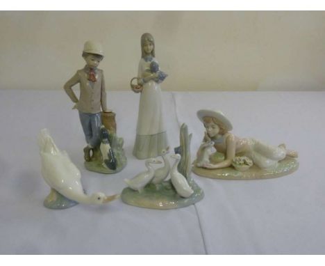 Five Nao and Nadal figurines