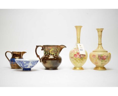 Two Royal Worcester vases, each decorated with colourful floral bouquets, the tallest 24cms high; two lustre jugs and a blue 