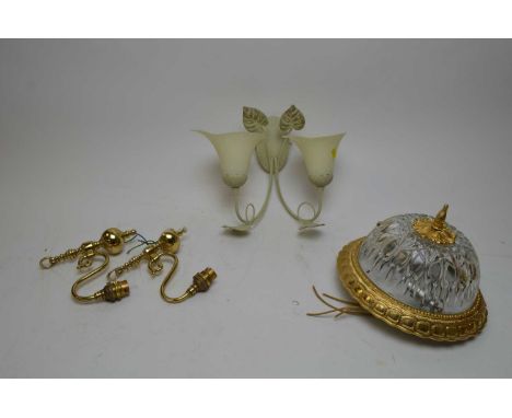 Pair of gilt metal three branch wall lights, the branches issuing from a shaped rectangular plaque moulded with shells and sc