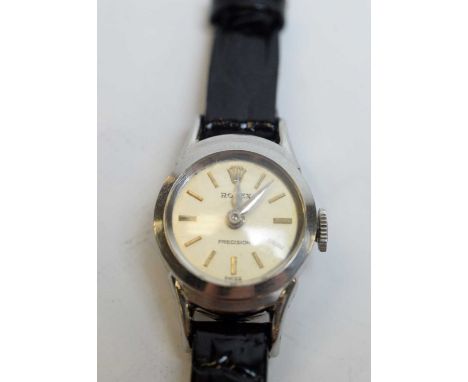 A 1960s lady's Rolex Precision stainless steel cased wristwatch, with manual-wind movement, champagne face, and baton markers