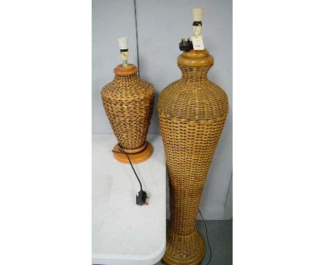 20th century rattan standard lamp, 139cms high; along with a similar table lamp. (2)