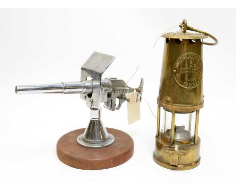 Eccles brass miners lamp; along with a scale model of a WWI railway canon. (2)
