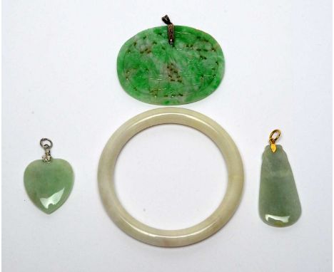 Four items of jade jewellery; including a plaque form pendant with pierced and engraved decoration depicting a pair of figure