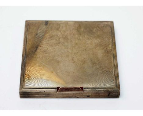 A lady's white-metal powder compact, of Art Deco influence, square section, with radially engraved covers, 5.9ozs.