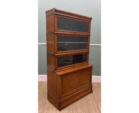 GLOBE WERNICKE CO. LIMITED OAK BOOKCASE, with three glazed shelves above a cupboard base, 154h x 87w x 38cms